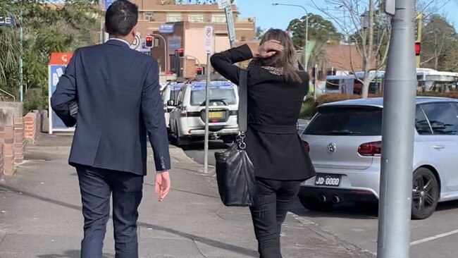 Alyssa Moon attempts to conseal her face with a scarf outside Hornsby Local Court. Picture: Madelaine Wong