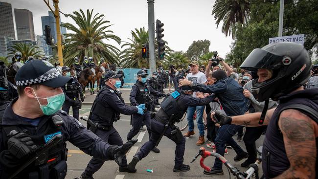 Protesters and members of Victoria Police clash in October at St Kilda