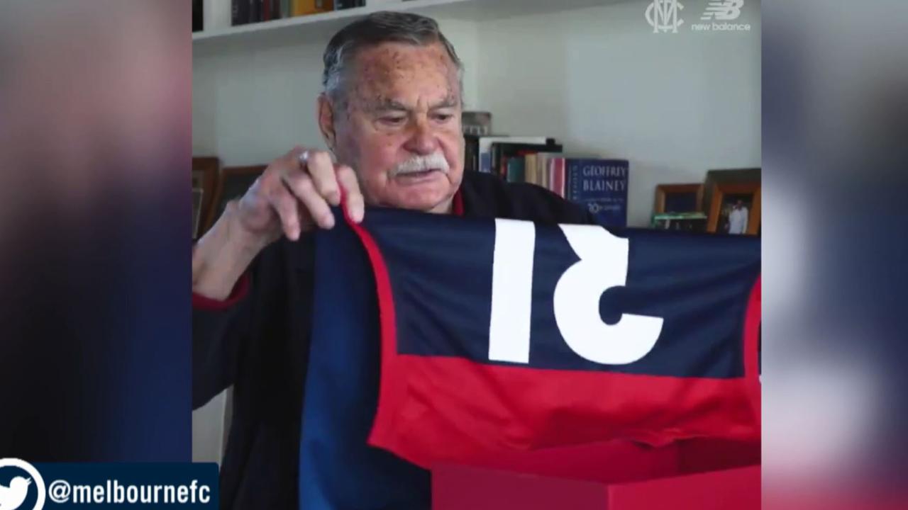 Ron Barassi looks at the special kit Melbourne will wear against Richmond.