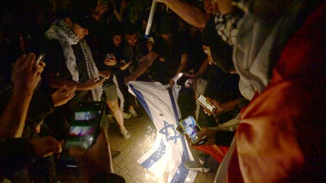 Some attendees at Monday’s Rally for a Free Palestine burned the Israeli flag. Picture: NCA NewsWire/ Jeremy Piper