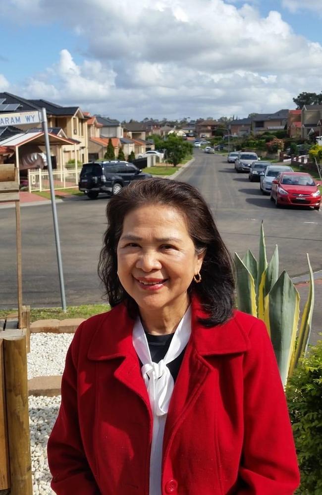 Erlinda Songcuan outside her Woodcroft house.