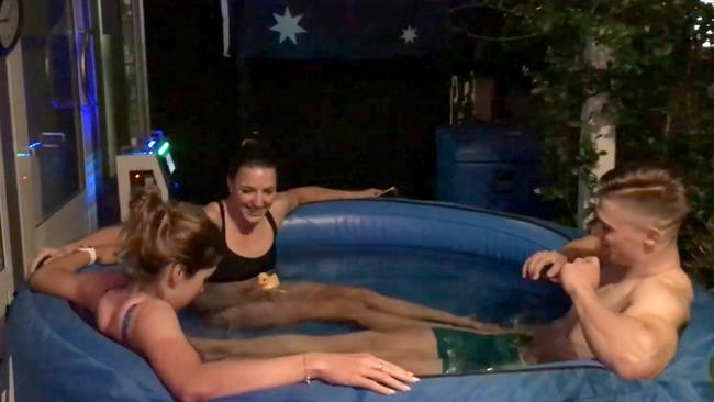 Aussie riders Georgia Baker, Rebecca Wiasak and Matthew Glaetzer in the ice bath at the team’s Brisbane headquarters.