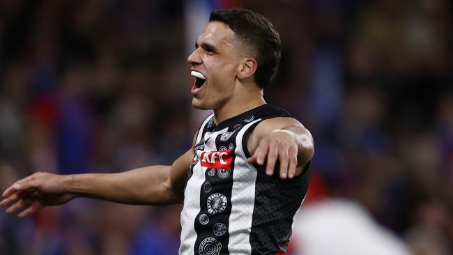 Ash Johnson of the Magpies celebrates a goal against the Western Bulldogs. Picture: Getty Images