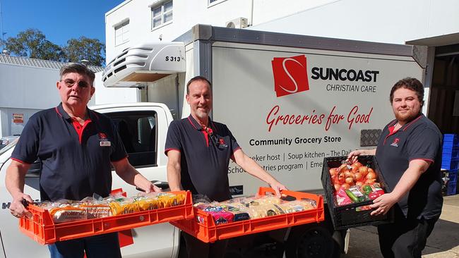 Suncoast Christian Care's John James, Brian Bakes, Dylan Terrey with some of the food for needy families.