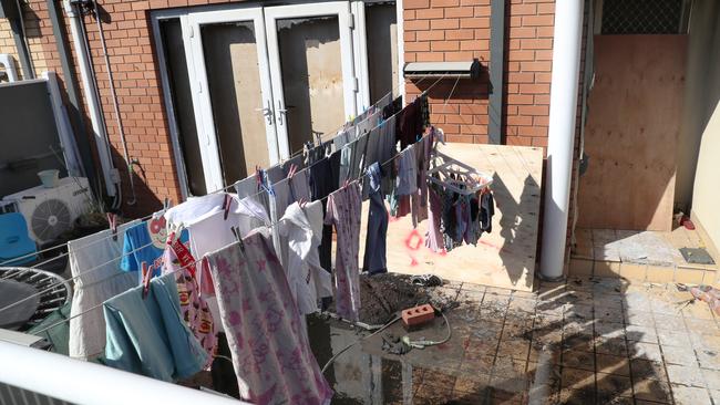 Laundry still hangs in the backyard, where scorch marks can be seen.