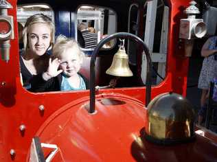Stacie Robertson, 13, and her three-year-old sister Emma check out the trains.