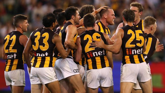 Jarryd Roughead is mobbed by teammates after kicking a goal in his first game since being diagnosed with cancer. Picture: Michael Klein.