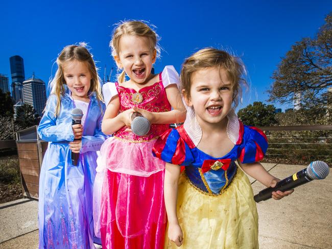 Queensland Museum is bringing back its hugely popular Disney sing-a-longs for Frozen and Encanto this month as part of Disney: The Magic of Animation.. Milly Shacklady, 4, Isabelle Knox, 4 and Lucy Knox, 2. Photo - Nigel Hallett