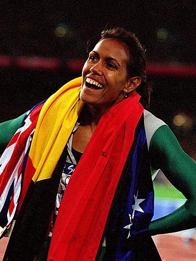 Cathy Freeman celebrates after winning gold in the Women's 400m final held at Olympic Stadium during the Sydney 2000 Olympic Games, Sydney, Australia. Credit: Nick Wilson/ALLSPORT