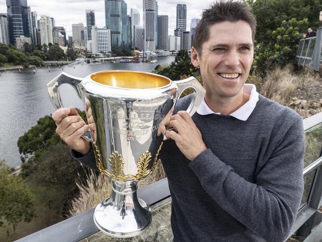 Lions great Simon Black gets his hands on the AFL Premiership Cup again. Picture: Matthew Poon