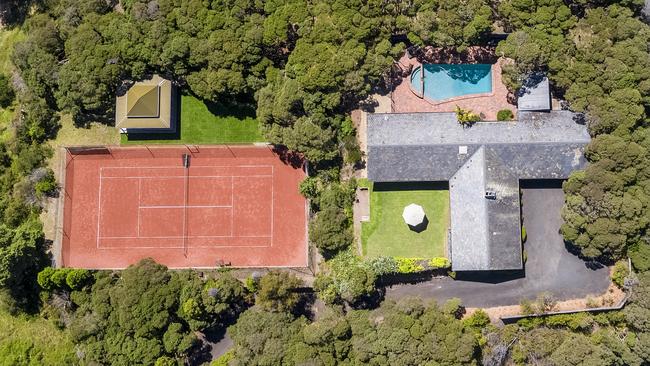 The property is a subdivided allotment with clay tennis courts and a swimming pool.