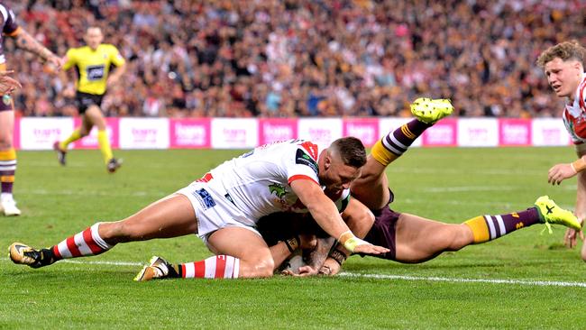Alex Glenn of the Broncos crosses for a try against the Dragons. Picture: Getty Images
