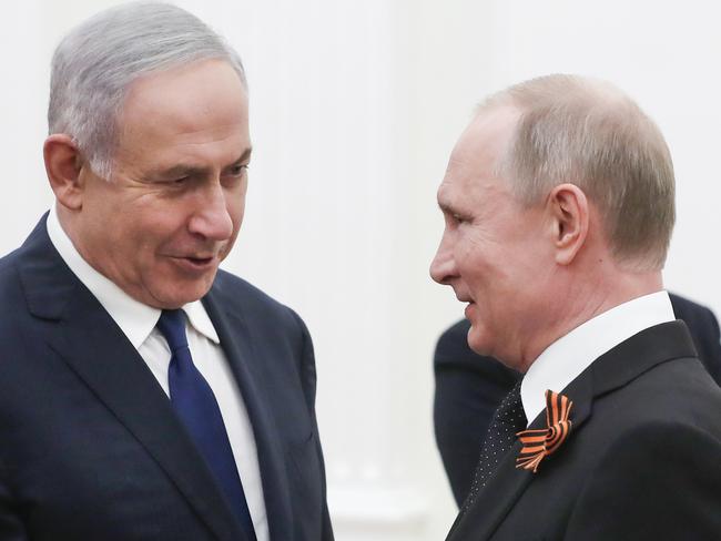 Russian President Vladimir Putin, right, shakes hands with Israeli Prime Minister Benjamin Netanyahu during their meeting in the Kremlin in Moscow, Russia, Wednesday, May 9, 2018. (Sergei Ilnitsky/Pool Photo via AP)