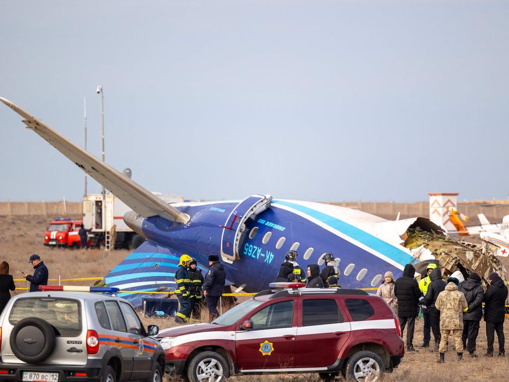 Emergency specialists work at the crash site of an Azerbaijan Airlines passenger jet near the western Kazakh city of Aktau on December 25, 2024. Picture: Issa Tazhenbayev / AFP.