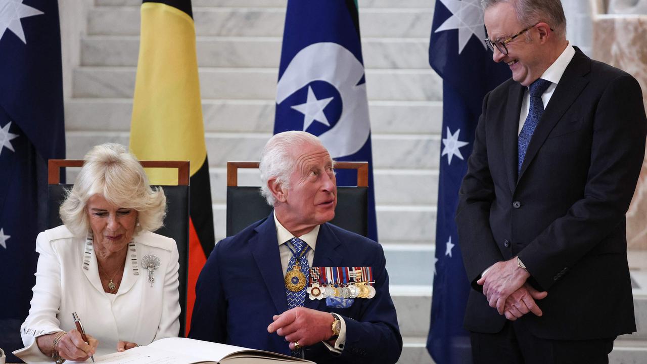 King Charles chats to Mr Albanese as Camilla signs the visitors' book in the Marble Foyer of Parliament House. Picture: David Gray/POOL/AFP