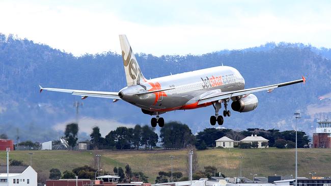 SUNTAS: Generic shots of planes taking off or coming into land, at Hobart Airport. a Jetstar plane landing