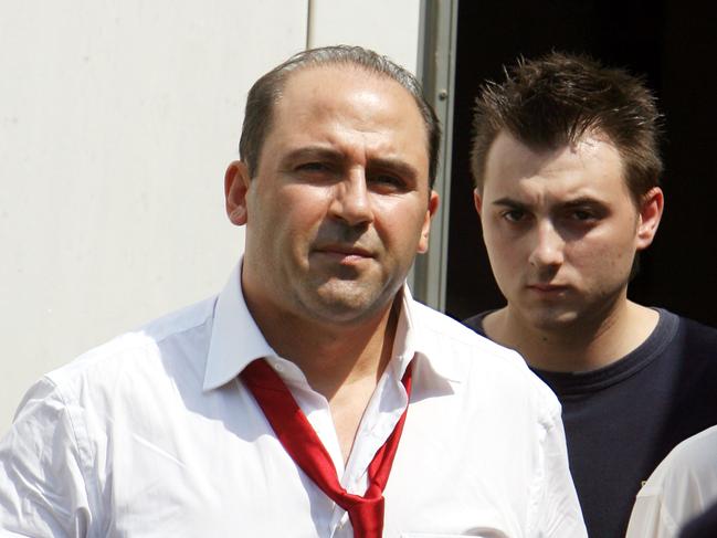 Tony Mokbel, a 41-year-old convicted drug trafficker, one of Australia's most wanted men, leaves a court escorted by police officers in Athens, Greece 24 Jul 2007. Mokbel appeared in court for an extradition hearing. He was arrested in Glyfada, a stylish suburb of Athens, 03 Jun. Mokbel absconded during his trial in Australia in Mar 2006 on charges of drug trafficking. (AP Photo/Thanassis Stavrakis)