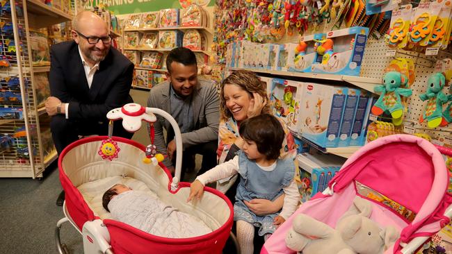 Baby Bunting CEO Matt Spencer, left, with customers in one of his stores. Picture: Stuart McEvoy