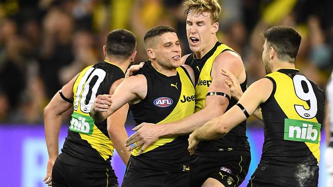 MELBOURNE, AUSTRALIA - SEPTEMBER 20: Dion Prestia of the Tigers is congratulated by team mates after kicking a goal during the AFL Preliminary Final match between the Richmond Tigers and the Geelong Cats at Melbourne Cricket Ground on September 20, 2019 in Melbourne, Australia. (Photo by Quinn Rooney/Getty Images)