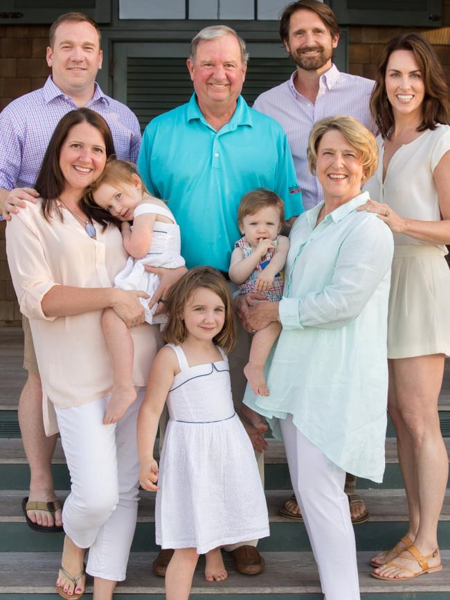 A photo of John Washburn (top row centre) and his family.