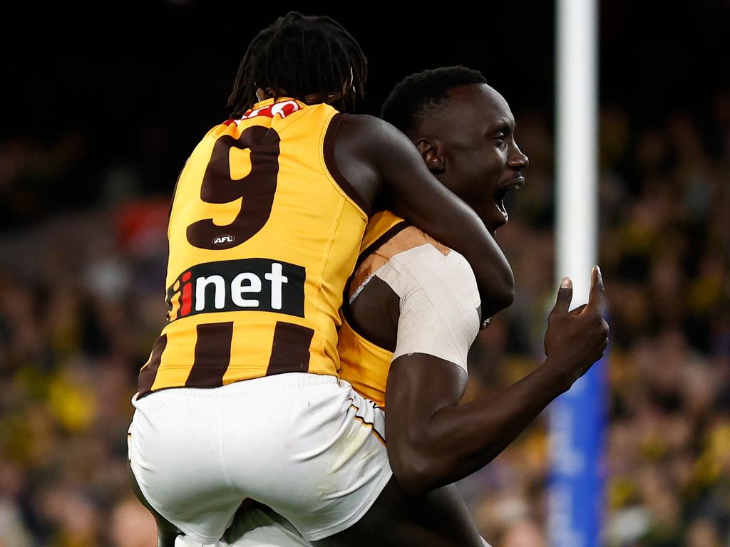 Mabior Chol and Changkuoth Jiath enjoy a goal. Picture: Michael Willson/AFL Photos via Getty Images
