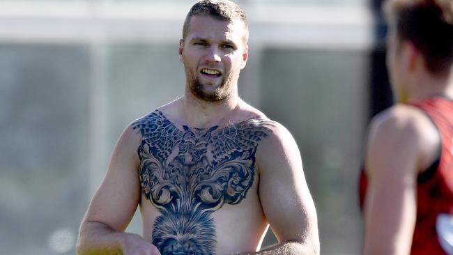 Jake Stringer shows off some new artwork at Essendon training on Wednesday.