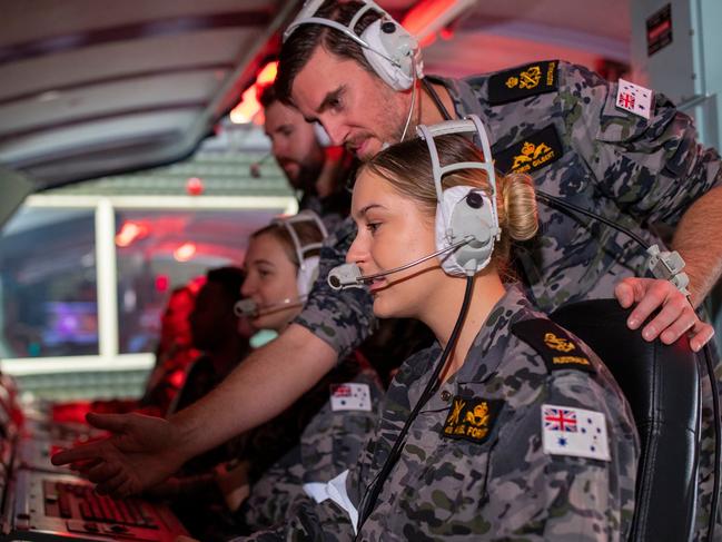 Petty Officer Acoustic Warfare Analyst Submariner Christopher Gilbert works with Leading Seaman Acoustic Warfare Analyst Submariner Angel Forwood during training in the combat simulator at Submarine Training and Systems Centre onboard HMAS Stirling. *** Local Caption *** Catering for both new and experienced Submariners, the options for sharpening your skills on one of the Submarine Training and Systems Centre's available simulators, is a crucial part of every submarinerâ€™s journey.  With simulators for propulsion systems that move to simulate sea state and submarine movements, combat and periscope simulators and the Bridge Simulator at Leeuwin Barracks, there are many opportunities to enhance existing core knowledge within a controlled environment. Picture: Royal Australian Navy / POIS Richard Cordell