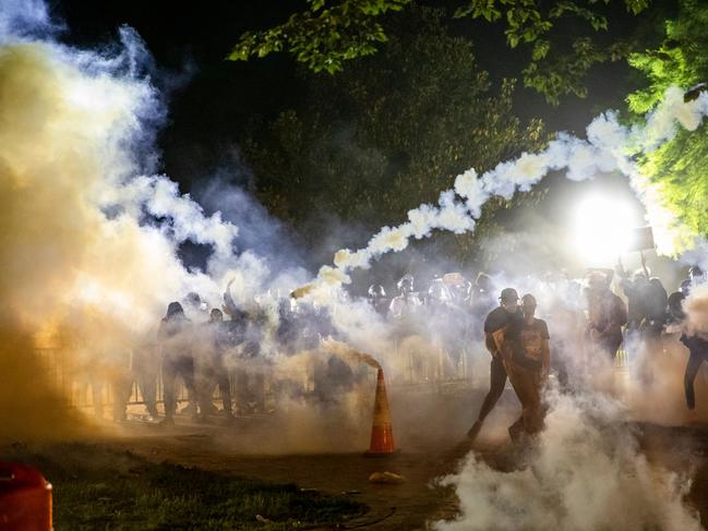 Teargas rises above as protesters face off with police during a demonstration outside the White House. Picture: AFP