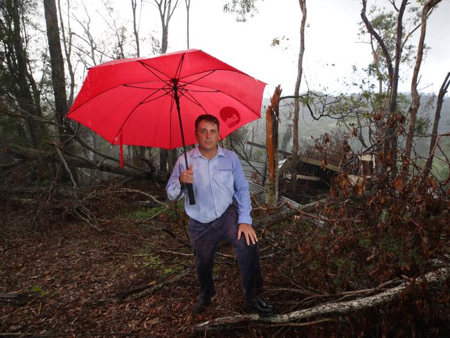 Member for Theodore Mark Boothman surveying the damage from storms and floods in Upper Coomera in January. Picture: Glenn Hampson.