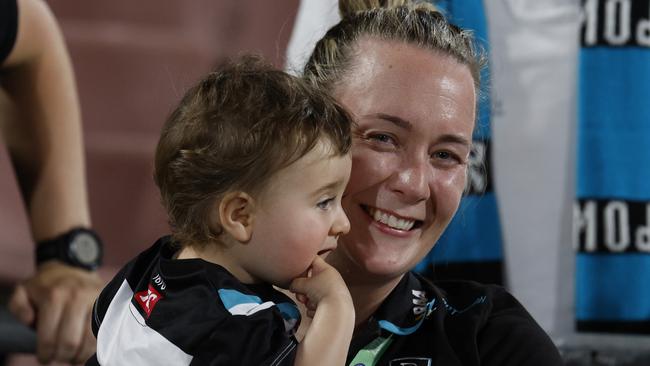 Port Adelaide coach Lauren Arnell with her baby daughter Marlie after game. Picture: Michael Klein