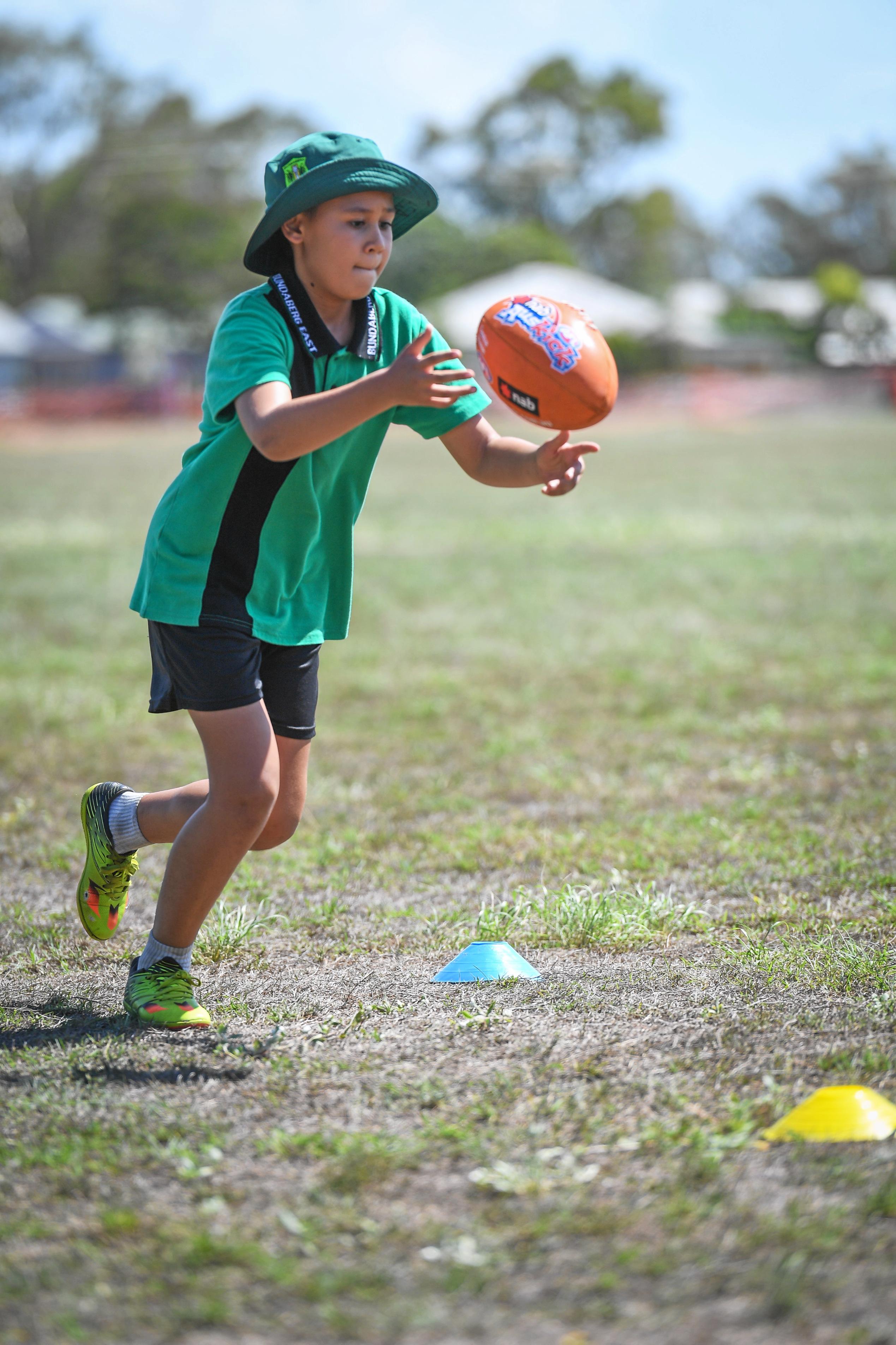 Taiga Mason takes control of the footy. Picture: Brian Cassidy