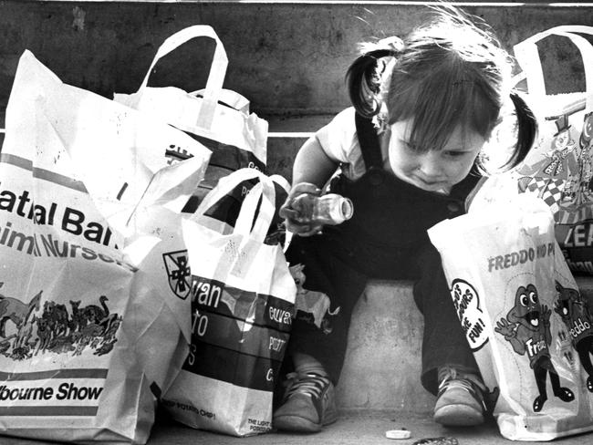 1981: A girl checks her showbags at the Royal Melbourne Show. Picture: HWT Library