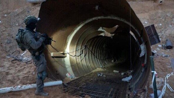 A soldier stands at the entrance to a large Hamas tunnel found near the Erez border crossing in the northern Gaza Strip. Picture: IDF