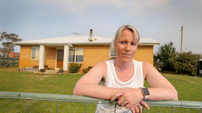 Rebecca Branch, of Bothwell, prepares to defend her home as uncontrollable fires burn across the Central Highlands. Picture: PATRICK GEE