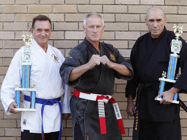 Mick Flanagan, Chief Instructor Warren John and Stephen Chamberlain from Universal Kempo Karate pose for a photo at Doonside today May 14, 2018. Mick and Stephen won first place in recent competition. (AAP Image/David Swift)