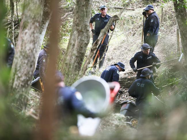 Police moved the search to the creek bed on Friday. Picture Peter Lorimer