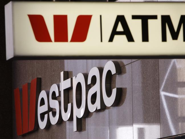 In this Nov. 3, 2010, file photo, signs are displayed at a Westpac branch in Sydney, Australia. Major Australian bank Westpac is facing a potentially massive fine after being accused of 23 million breaches of the anti-money laundering and counterterrorism financing act. (AP Photo/Rick Rycroft, FIle)