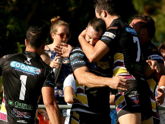 Bulls Chad O'Donnell, right, congratulates Thomas Young on his try.