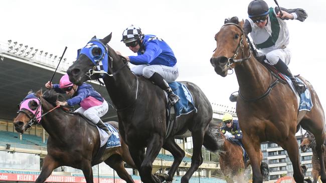 Lakota Fire (middle) grabs victory on the post at The Valley. Picture: Ross Holburt-Racing Photos via Getty Images