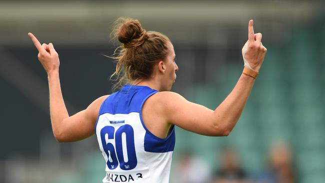 Emma King of the Kangaroos celebrates a goal in the win.