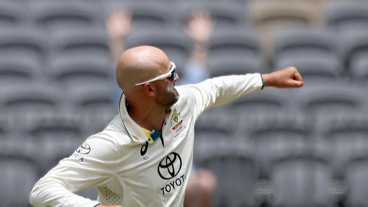 Australia's Nathan Lyon celebrates after taking the wicket of Pakistan's Imam-ul-Haq. Photo by COLIN MURTY / AFP
