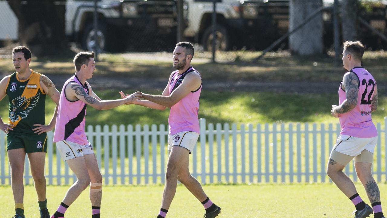 Rohan Drummond (centre) celebrates his goal for Toowoomba Tigers. Picture: Kevin Farmer