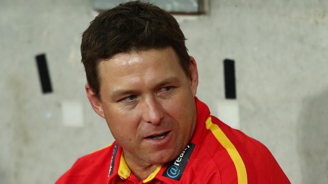 GOLD COAST, AUSTRALIA - AUGUST 06: Suns coach Stuart Dew looks on during the round 10 AFL match between the Gold Coast Suns and the St Kilda Saints at Metricon Stadium on August 06, 2020 in Gold Coast, Australia. (Photo by Chris Hyde/Getty Images)