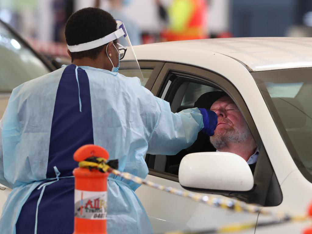 A man (who gave permission to be photographed) gets tested at the Melbourne Showgrounds in Flemington. Picture: NCA NewsWire/David Crosling