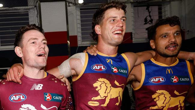 ADELAIDE, AUSTRALIA - APRIL 05: Noah Answerth, Lachie Neale, Jarrod Berry and Callum Ah Chee of the Lions sing the team song during the 2024 AFL Round 04 match between the Brisbane Lions and the North Melbourne Kangaroos at Norwood Oval on April 05, 2024 in Adelaide, Australia. (Photo by Dylan Burns/AFL Photos via Getty Images)