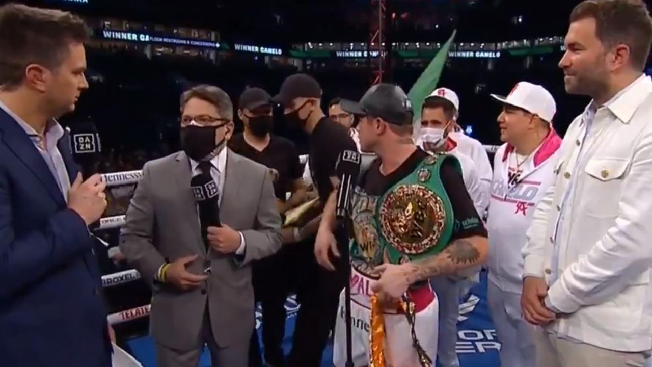 Canelo tells the fans to get out of the ring.