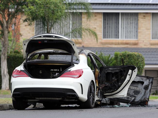 A white Mercedes was used as the getaway vehicle and was later found burnt out. Picture: Craig Greenhill