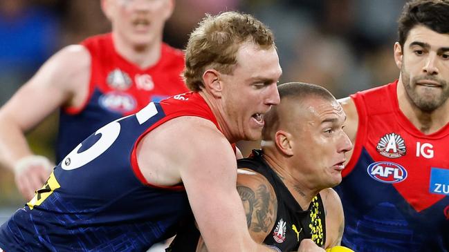 MELBOURNE, AUSTRALIA - APRIL 24: Dustin Martin of the Tigers is tackled by Harrison Petty of the Demons during the 2024 AFL Round 07 match between the Richmond Tigers and the Melbourne Demons at the Melbourne Cricket Ground on April 24, 2024 in Melbourne, Australia. (Photo by Dylan Burns/AFL Photos via Getty Images)