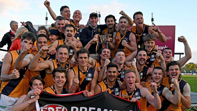 Strathmore players celebrate with the premiership cup after winning the EDFL Premier Division grand final. Picture: Andy Brownbill