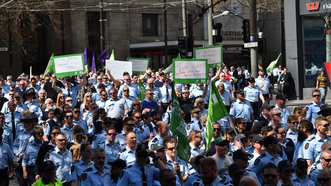 Members of the Public Service Association on their way to a rally at Parliament House in Adelaide last September. (AAP Image/David Mariuz)